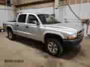 2003 Dodge Dakota Sport with VIN 1D7HG38X83S300059, listed as a Copart auction lot 61420305 with 230,971 mi miles and Salvage title. Bid and sale history available at DreamBid. Image 4.