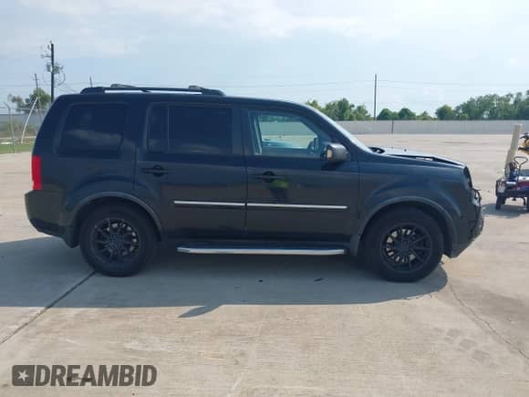 2012 Honda Pilot Touring with VIN 5FNYF4H93CB044933, listed as a IAAI auction lot 43249328 with 218,196 mi miles and . Bid and sale history available at DreamBid. Image 13.