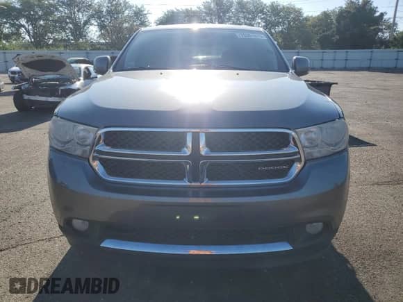 2012 Dodge Durango Crew z VIN 1C4RDJDG5CC112658, wystawiony jako Copart lot #70361875 z przebiegiem 215 458 mil mil oraz Czysty tytuł • Clean title. Historia ofert i sprzedaży dostępna na DreamBid. Obrazek 5.