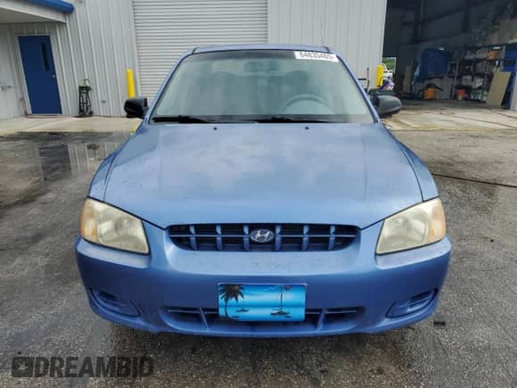2002 Hyundai Accent GL z VIN KMHCG45C52U288494, wystawiony jako Copart lot #64835465 z przebiegiem 124 538 mil mil oraz Szkoda całkowita • Salvage title. Historia ofert i sprzedaży dostępna na DreamBid. Obrazek 5.