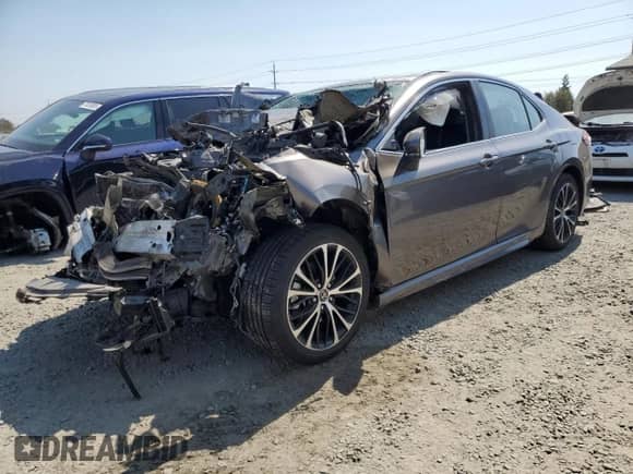 2019 Toyota Camry Hybrid LE с VIN 4T1B21HK2KU513773, выставлен на аукционе Copart как лот 70576645 с пробегом Не указан миль и Списание • Salvage title. История ставок и продаж доступна на DreamBid. Изображение 1.