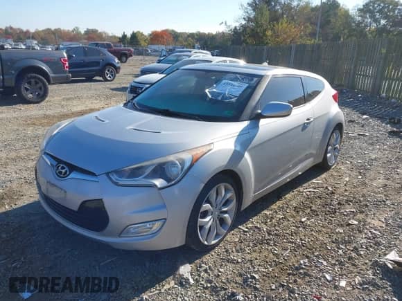 2013 Hyundai Veloster w/Gray Int with VIN KMHTC6AD5DU161303, listed as a IAAI auction lot 43544609 with 134,047 mi miles and . Bid and sale history available at DreamBid. Image 2.