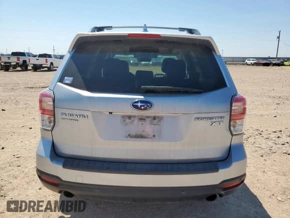 2017 Subaru Forester Touring z VIN JF2SJGWC6HH498784, wystawiony jako Copart lot #71694785 z przebiegiem 65 980 mil mil oraz Czysty tytuł • Clean title. Historia ofert i sprzedaży dostępna na DreamBid. Obrazek 6.
