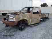 1999 Ford F-150 z VIN 1FTZF0825XKB25411, wystawiony jako Copart lot #69858225 z przebiegiem Nie podano mil oraz Szkoda całkowita • Salvage title. Historia ofert i sprzedaży dostępna na DreamBid. Obrazek 1.