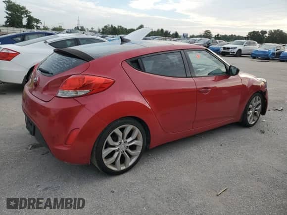 2012 Hyundai Veloster w/Red Int z VIN KMHTC6AD1CU070298, wystawiony jako Copart lot #71091355 z przebiegiem 144 305 mil mil oraz Czysty tytuł • Clean title. Historia ofert i sprzedaży dostępna na DreamBid. Obrazek 3.