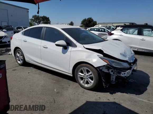 2018 Chevrolet Cruze LT with VIN 1G1BE5SMXJ7181035, listed as a Copart auction lot 70885385 with 115,122 mi miles and Salvage title. Bid and sale history available at DreamBid. Image 4.