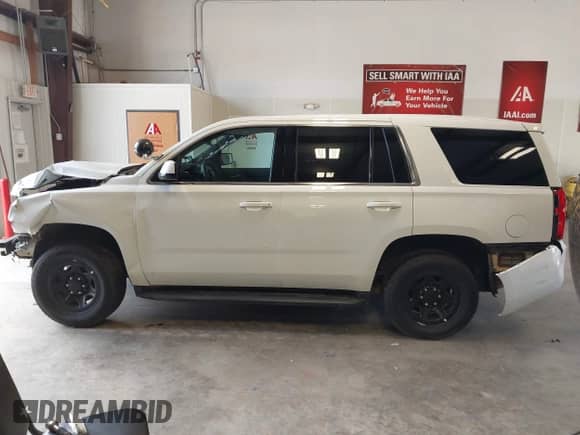 2020 Chevrolet Tahoe Commercial z VIN 1GNLCDECXLR154849, wystawiony jako IAAI lot #42050778 z przebiegiem 124 771 mil mil oraz . Historia ofert i sprzedaży dostępna na DreamBid. Obrazek 14.