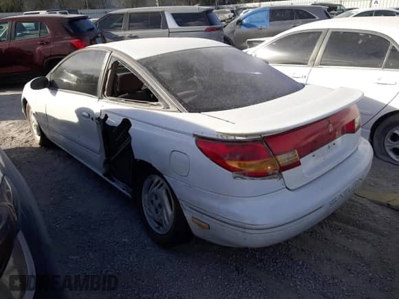 1998 Saturn SC с VIN 1G8ZH1279WZ120989, выставлен на аукционе Copart как лот 84348634 с пробегом 117 748 миль миль и На запчасти • Non repairable. История ставок и продаж доступна на DreamBid. Изображение 2.