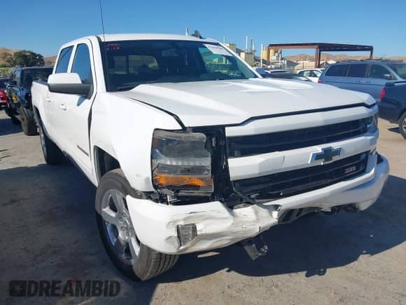 2018 Chevrolet Silverado 1500 LT with VIN 1GCUKRECXJF180945, listed as a IAAI auction lot 42450588 with 108,199 mi miles and . Bid and sale history available at DreamBid. Image 6.