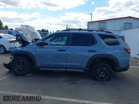2023 Honda Pilot TrailSport with VIN 5FNYG1H64PB000379, listed as a IAAI auction lot 42990555 with 38,388 mi miles and . Bid and sale history available at DreamBid. Image 15.