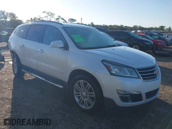2014 Chevrolet Traverse LT z VIN 1GNKRGKDXEJ351403, wystawiony jako IAAI lot #43478003 z przebiegiem 128 967 mil mil oraz . Historia ofert i sprzedaży dostępna na DreamBid. Obrazek 1.