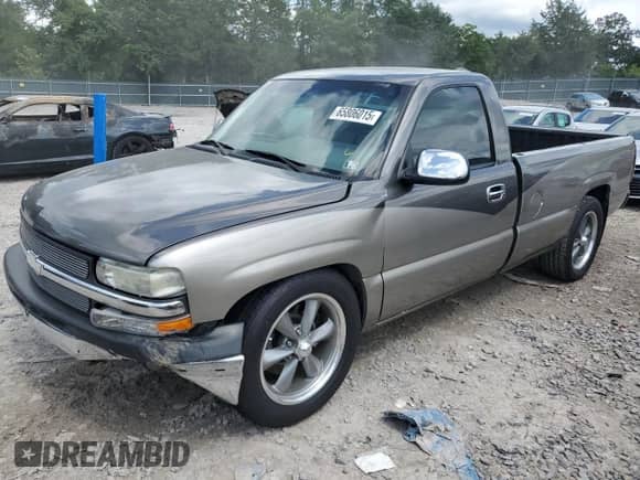 1999 Chevrolet Silverado 1500 with VIN 1GCEC14V0XE137610, listed as a Copart auction lot 65806015 with 103,303 mi miles and Salvage title. Bid and sale history available at DreamBid. Image 1.