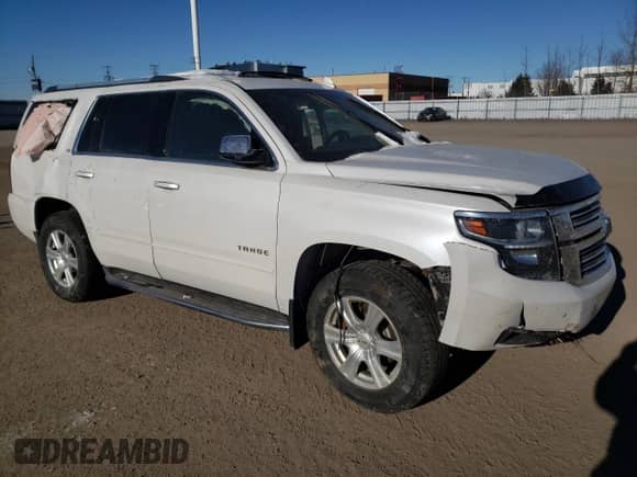 2016 Chevrolet Tahoe LTZ with VIN 1GNSKCKC7GR380379, listed as a Copart auction lot 87702125 with 165,339 mi miles and Clean title. Bid and sale history available at DreamBid. Image 4.