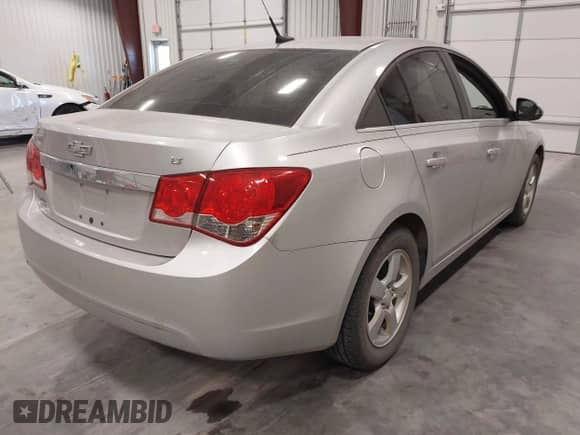 2014 Chevrolet Cruze 1LT with VIN 1G1PC5SB1E7386873, listed as a IAAI auction lot 43348082 with 164,987 mi miles and . Bid and sale history available at DreamBid. Image 4.