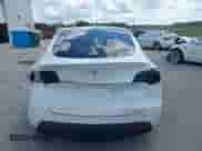 2022 Tesla Model Y Long Range z VIN 7SAYGDEE1NF385915, wystawiony jako IAAI lot #42458295 z przebiegiem 68 345 mil mil oraz . Historia ofert i sprzedaży dostępna na DreamBid. Obrazek 16.