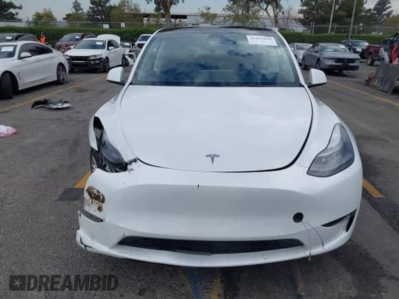 2023 Tesla Model Y Long Range with VIN 7SAYGAEE2PF763662, listed as a IAAI auction lot 43412618 with 43,857 mi miles and . Bid and sale history available at DreamBid. Image 12.