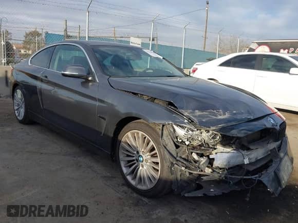 2014 BMW 4 Series 428i with VIN WBA3N7C5XEF719384, listed as a IAAI auction lot 41694678 with 115,517 mi miles and . Bid and sale history available at DreamBid. Image 1.