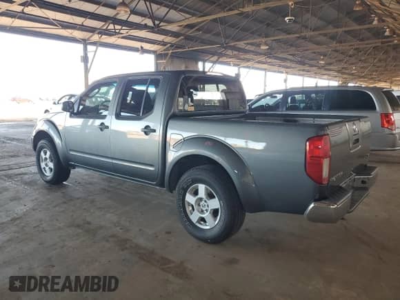 2007 Nissan Frontier SE with VIN 1N6AD07U67C431739, listed as a Copart auction lot 86591175 with 131,668 mi miles and Salvage title. Bid and sale history available at DreamBid. Image 2.
