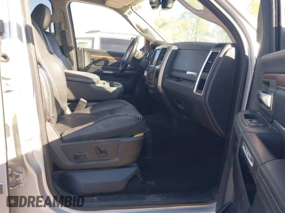 2014 Ram 1500 Laramie z VIN 1C6RR7VM7ES480087, wystawiony jako IAAI lot #42056108 z przebiegiem Nie podano mil oraz . Historia ofert i sprzedaży dostępna na DreamBid. Obrazek 5.