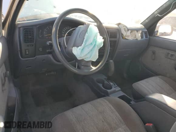 1998 Toyota Tacoma with VIN 4TASM92N1WZ175674, listed as a Copart auction lot 89734125 with 214,966 mi miles and Salvage title. Bid and sale history available at DreamBid. Image 8.