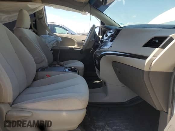 2014 Toyota Sienna LE with VIN 5TDKK3DC4ES411981, listed as a Copart auction lot 63111835 with 149,248 mi miles and Salvage title. Bid and sale history available at DreamBid. Image 7.