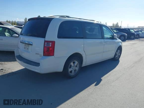 2010 Dodge Grand Caravan SXT with VIN 2D4RN5D1XAR131178, listed as a IAAI auction lot 43390738 with 171,404 mi miles and . Bid and sale history available at DreamBid. Image 4.