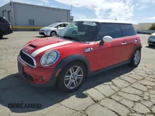 2011 MINI Hardtop S with VIN WMWSV3C50BTY12562, listed as a Copart auction lot 61183425 with 125,126 mi miles and Salvage title. Bid and sale history available at DreamBid. Image 1.