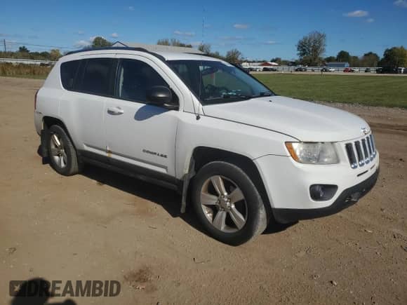 2011 Jeep Compass Latitude with VIN 1J4NF1FB7BD155055, listed as a Copart auction lot 82468995 with 202,863 mi miles and Salvage title. Bid and sale history available at DreamBid. Image 4.