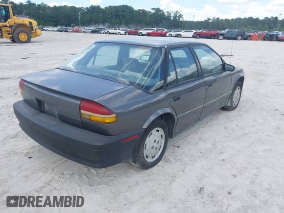 1994 Saturn SL with VIN 1G8ZF559XRZ190063, listed as a IAAI auction lot 42467911 with 66,680 mi miles and . Bid and sale history available at DreamBid. Image 4.