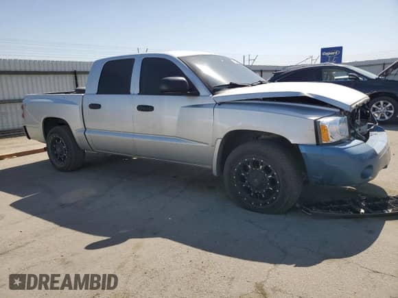 2007 Dodge Dakota z VIN 1D3HE28K57S191541, wystawiony jako Copart lot #73762424 z przebiegiem 184 274 mil mil oraz Szkoda całkowita • Salvage title. Historia ofert i sprzedaży dostępna na DreamBid. Obrazek 4.