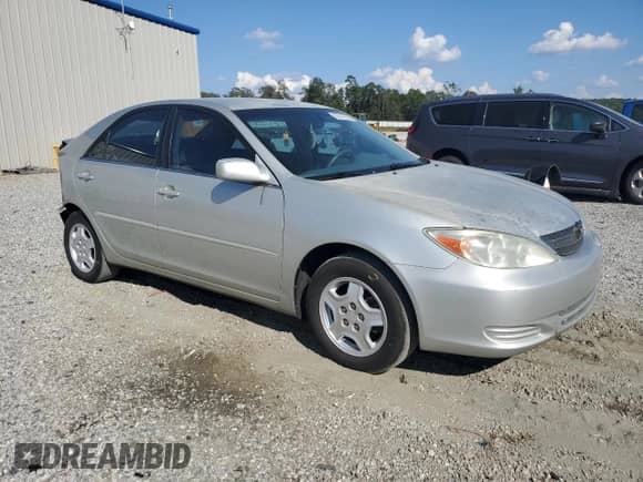 2002 Toyota Camry LE z VIN 4T1BE32K82U006520, wystawiony jako Copart lot #82041025 z przebiegiem 313 302 mil mil oraz Szkoda całkowita • Salvage title. Historia ofert i sprzedaży dostępna na DreamBid. Obrazek 4.