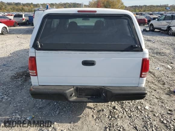 2003 Dodge Dakota z VIN 1D7FL16XX3S353971, wystawiony jako Copart lot #77018554 z przebiegiem Nie podano mil oraz Szkoda całkowita • Salvage title. Historia ofert i sprzedaży dostępna na DreamBid. Obrazek 6.
