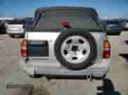 2002 Chevrolet Tracker with VIN 2CNBE18C226913895, listed as a Copart auction lot 83248644 with 122,332 mi miles and Clean title. Bid and sale history available at DreamBid. Image 6.