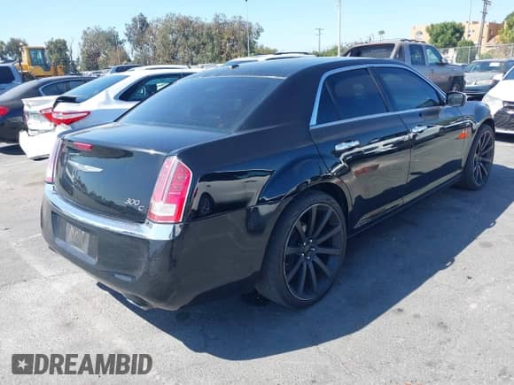 2014 Chrysler 300 C with VIN 2C3CCAET5EH117674, listed as a IAAI auction lot 43112038 with 127,495 mi miles and . Bid and sale history available at DreamBid. Image 4.