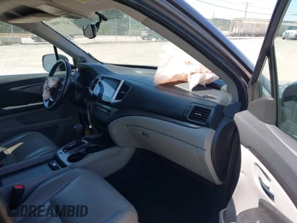 2018 Honda Pilot EX-L with VIN 5FNYF5H50JB006656, listed as a IAAI auction lot 43179982 with 130,515 mi miles and . Bid and sale history available at DreamBid. Image 5.