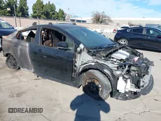 2022 Toyota Prius L Eco with VIN JTDKAMFU0N3161123, listed as a IAAI auction lot 41319184 with Not provided miles and . Bid and sale history available at DreamBid. Image 1.