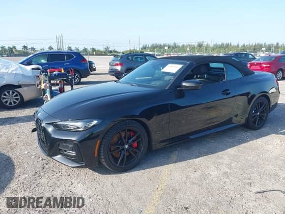 2022 BMW 4 Series 430i with VIN WBA23AT06NCJ10779, listed as a IAAI auction lot 42000961 with 49,634 mi miles and . Bid and sale history available at DreamBid. Image 2.