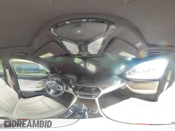 2018 BMW 5 Series M550i xDrive with VIN WBAJB9C54JB035699, listed as a Copart auction lot 71395105 with 94,373 mi miles and Salvage title. Bid and sale history available at DreamBid. Image 14.