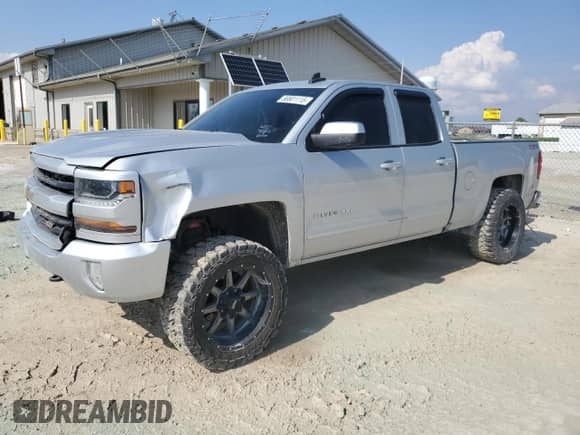 2017 Chevrolet Silverado 1500 LT with VIN 1GCVKREH3HZ115640, listed as a Copart auction lot 58801115 with 159,528 mi miles and Salvage title. Bid and sale history available at DreamBid. Image 1.
