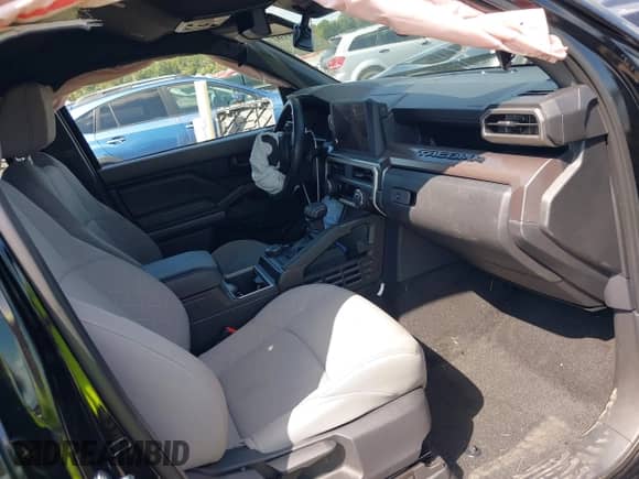 2024 Toyota Tacoma SR5 with VIN 3TMLB5JN7RM077957, listed as a IAAI auction lot 43149381 with 11,806 mi miles and . Bid and sale history available at DreamBid. Image 5.