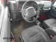 2001 Jeep Wrangler Sport with VIN 1J4FA49S11P339047, listed as a Copart auction lot 85923625 with 144,267 mi miles and Salvage title. Bid and sale history available at DreamBid. Image 8.