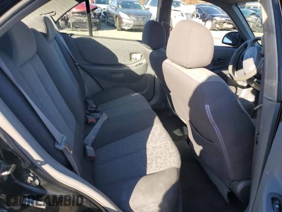 2005 Hyundai Accent GLS с VIN KMHCG45C15U662362, выставлен на аукционе Copart как лот 80574774 с пробегом 122 898 миль миль и Списание • Salvage title. История ставок и продаж доступна на DreamBid. Изображение 11.