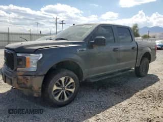 2020 Ford F-150 XL with VIN 1FTEW1E55LKD05940, listed as a Copart auction lot 69801955 with 125,880 mi miles and Salvage title. Bid and sale history available at DreamBid. Image 1.
