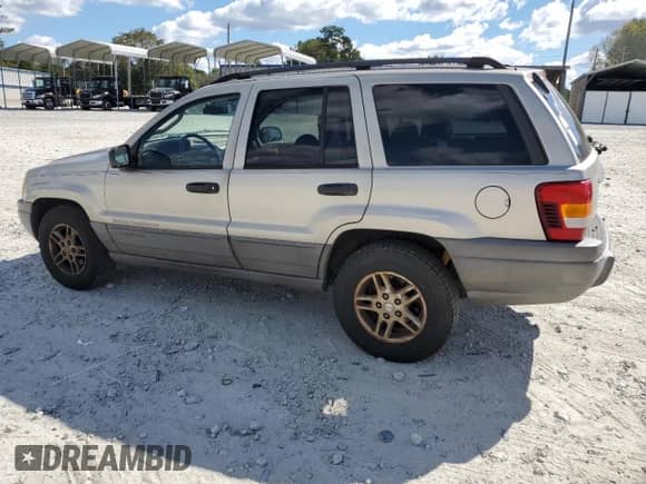 2004 Jeep Grand Cherokee Laredo with VIN 1J4GX48S64C302687, listed as a Copart auction lot 85599075 with 213,057 mi miles and Salvage title. Bid and sale history available at DreamBid. Image 2.