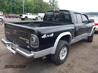 2004 Dodge Dakota SLT z VIN 1D7HG48N34S677100, wystawiony jako IAAI lot #42885294 z przebiegiem Nie podano mil oraz . Historia ofert i sprzedaży dostępna na DreamBid. Obrazek 4.