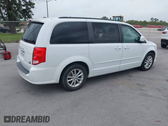 2014 Dodge Grand Caravan SXT 30th Anniversary with VIN 2C4RDGCG0ER254057, listed as a IAAI auction lot 40737960 with 142,301 mi miles and . Bid and sale history available at DreamBid. Image 4.