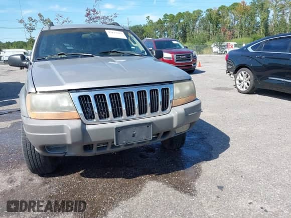 2002 Jeep Grand Cherokee Laredo with VIN 1J4GX48S32C127277, listed as a IAAI auction lot 43125887 with 139,410 mi miles and . Bid and sale history available at DreamBid. Image 6.
