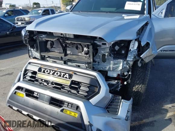 2024 Toyota Tacoma SR5 with VIN 3TMLB5JN6RM022612, listed as a IAAI auction lot 41611378 with 7,275 mi miles and . Bid and sale history available at DreamBid. Image 6.