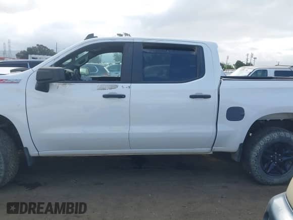 2022 Chevrolet Silverado 1500 Custom Trail Boss with VIN 3GCPYCEK3NG147175, listed as a IAAI auction lot 38760584 with 9,256 mi miles and . Bid and sale history available at DreamBid. Image 14.