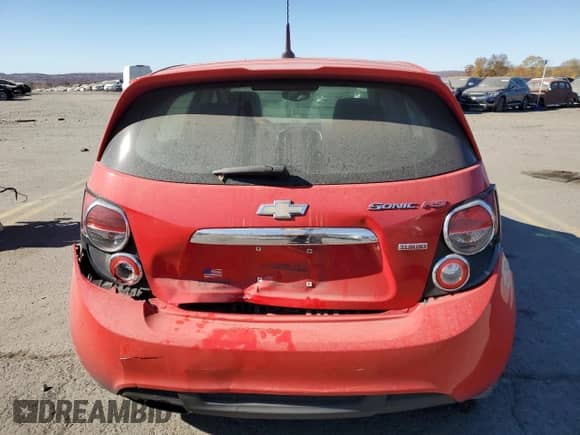 2014 Chevrolet Sonic RS with VIN 1G1JG6SB0E4133237, listed as a Copart auction lot 77207084 with 108,950 mi miles and Salvage title. Bid and sale history available at DreamBid. Image 6.